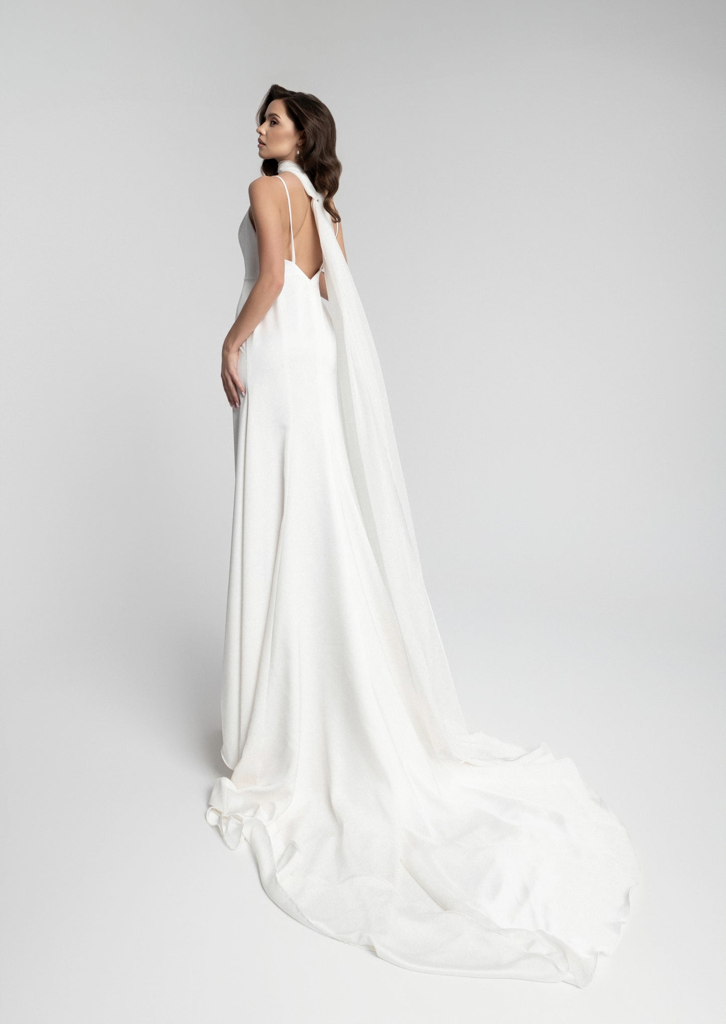 Chic Minimalist Bridal Gown with Flowy Scarf and Sleek Silhouette - Celerona