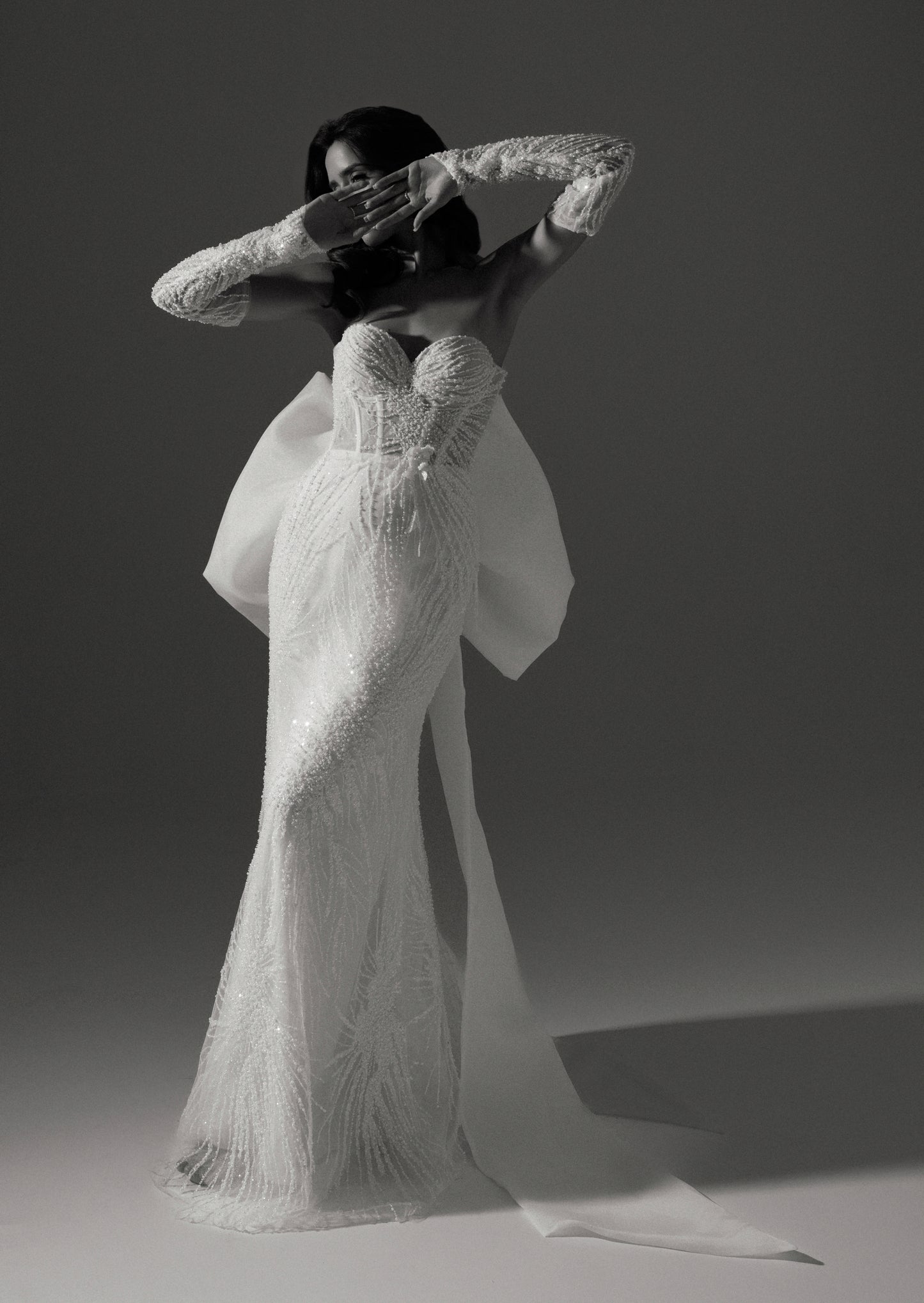 Glamorous Strapless Straight Wedding Dress with Sleeves and Oversized Bow Train - Caren