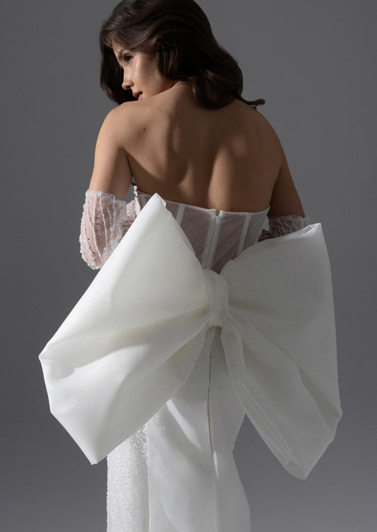 Glamorous Strapless Straight Wedding Dress with Sleeves and Oversized Bow Train - Caren